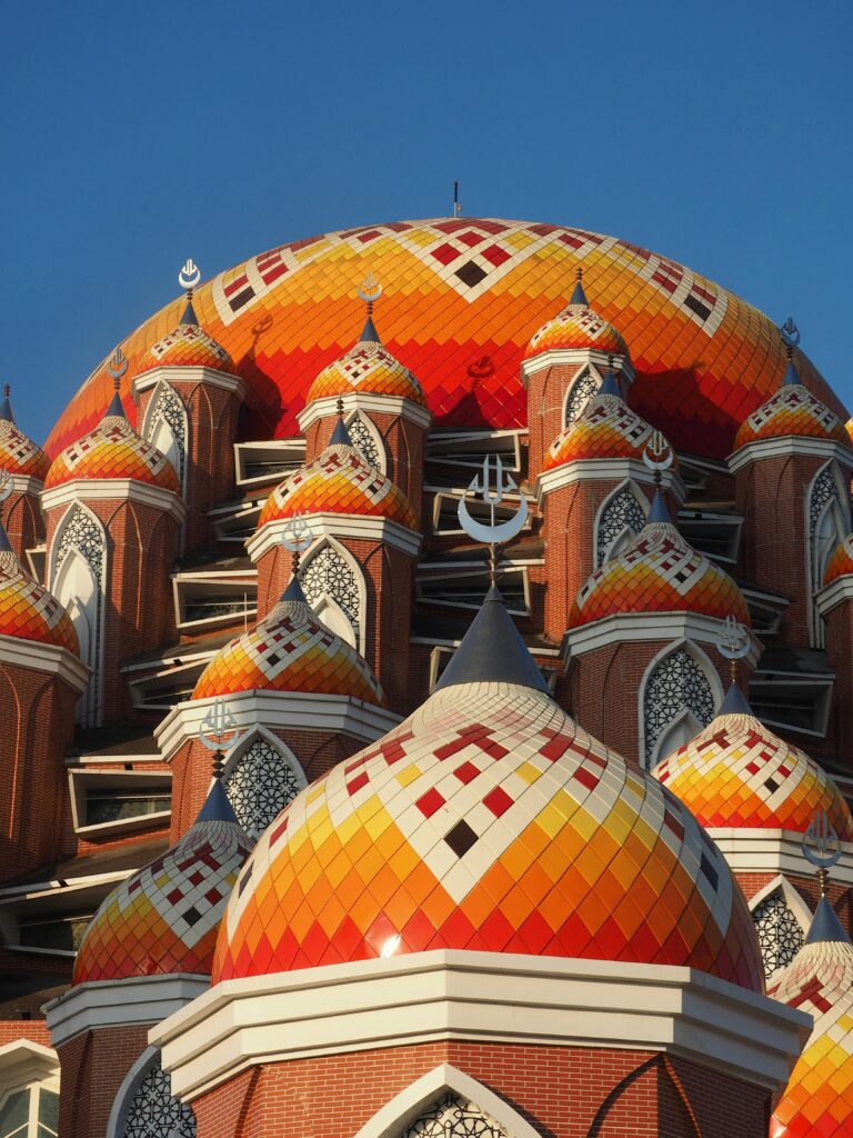 pexels-photo-18153438-18153438 Vibrant domes of the 99 Kubah Mosque in Makassar, featuring intricate designs and warm hues.